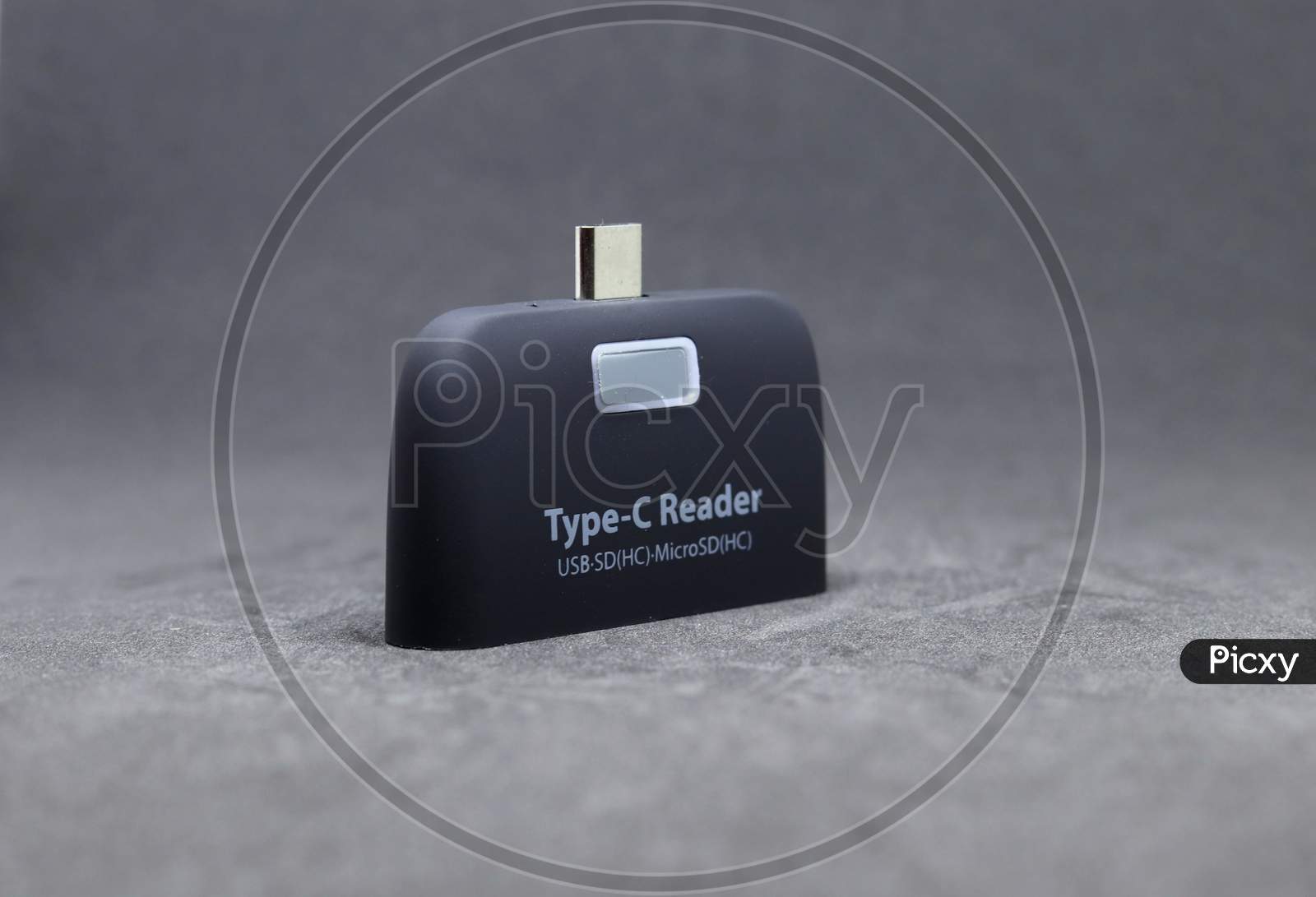 Type C Reader USB 3.1 Multi function adapter with grey background.