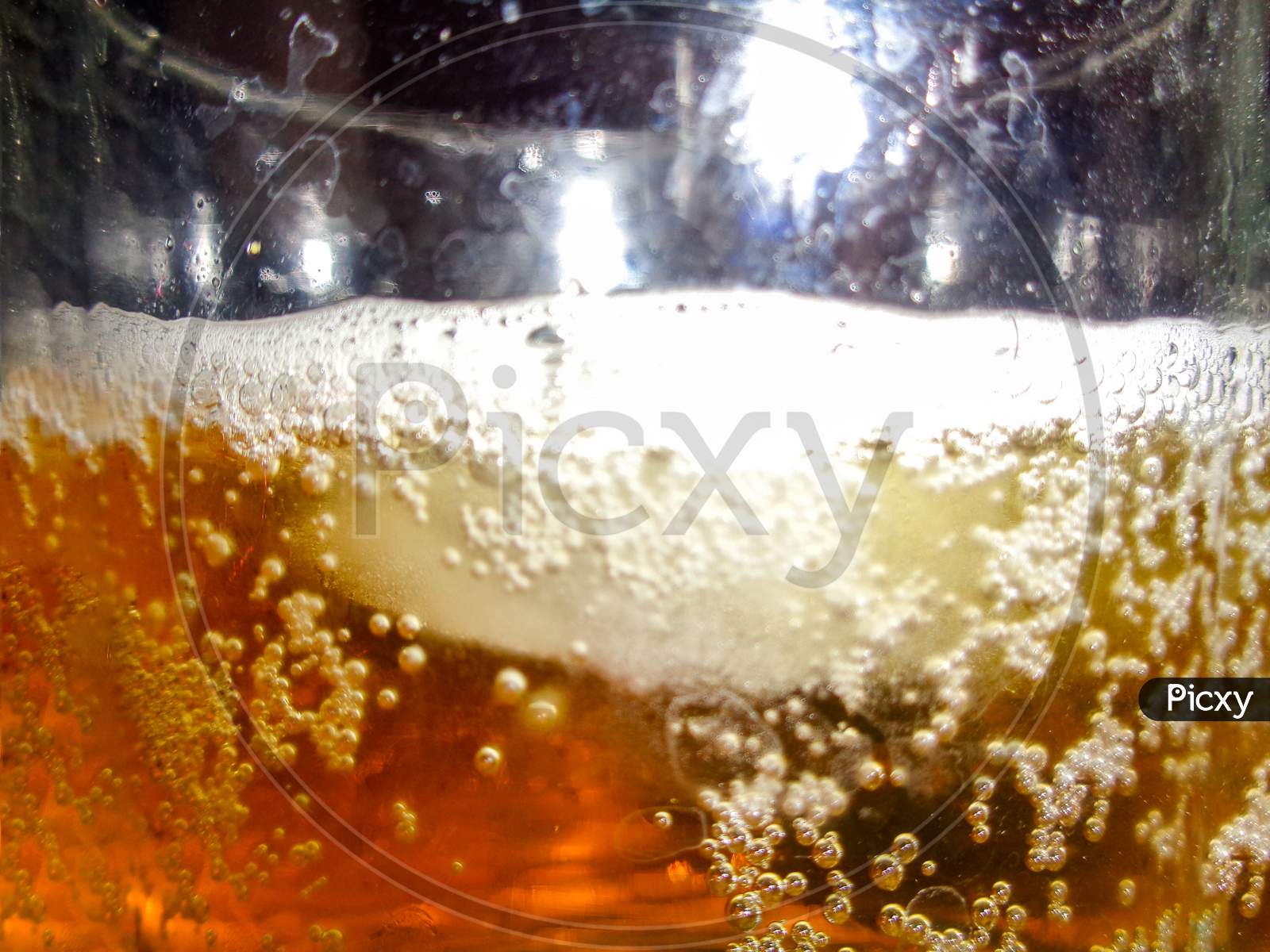 Close-up view of beer liquid bubble in the beer mug
