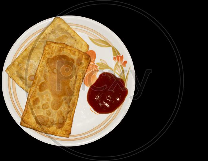 Pizza Puff, Puffed Pizza isolated with Black Background Top View
