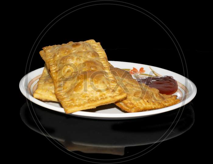 Pizza Puff, Puffed Pizza isolated with Black Background with shadow