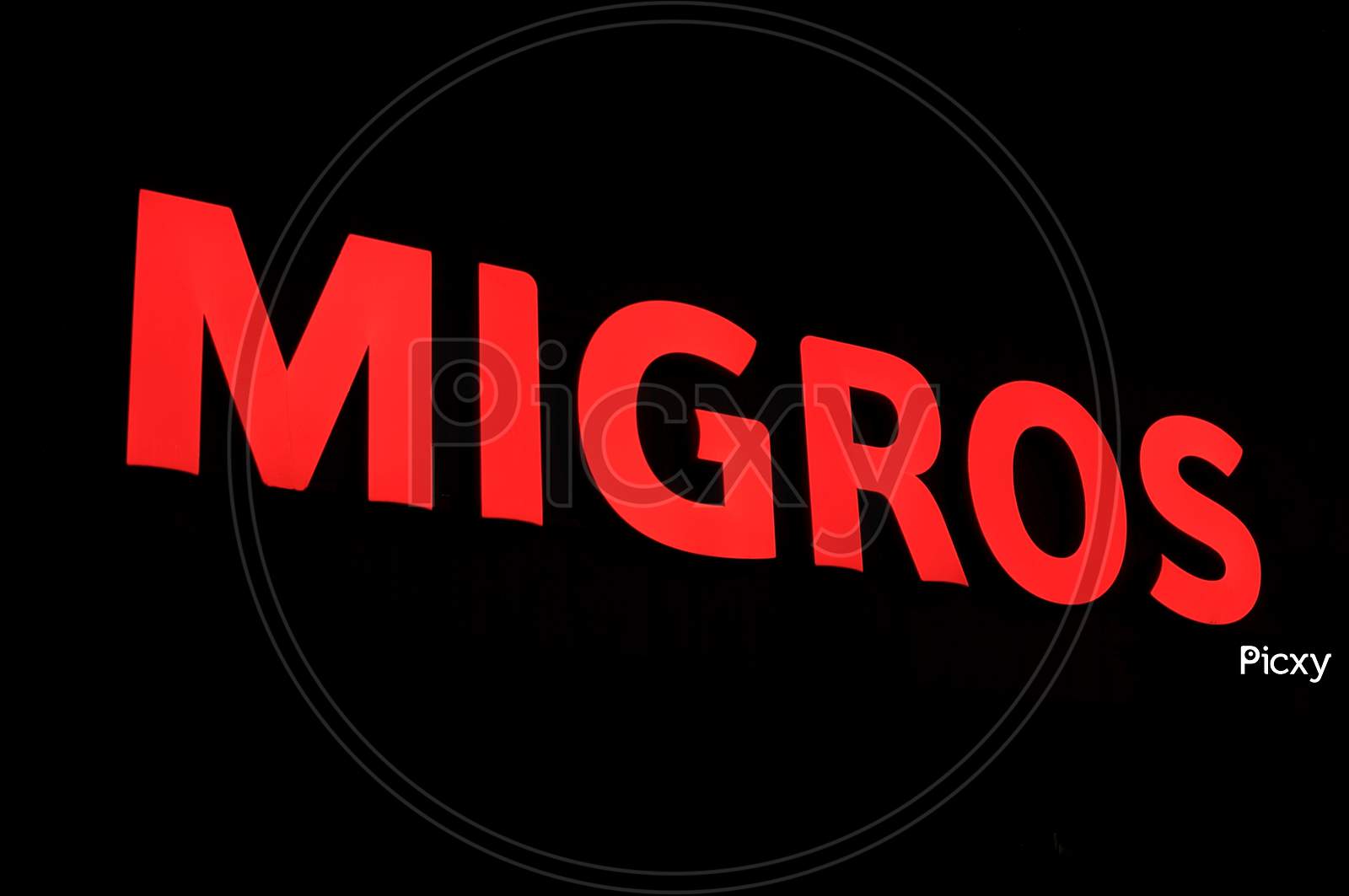 Illuminated Migros Sign