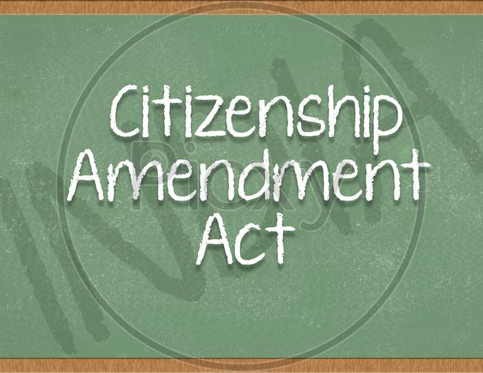 Citizenship Amendment Act Written On Green Black Board With India As A Background.