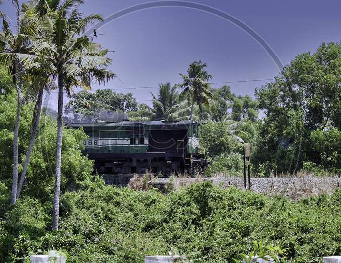 Indian Train Engine Goes Through A Forest Area In Kerala, India