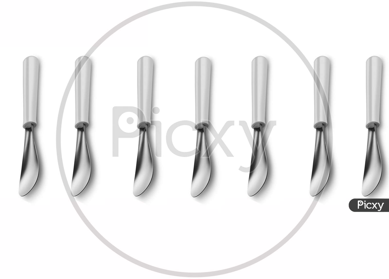 Seven Vertically Kept Silver Metal Cooking Spatula Isolated On A White Background