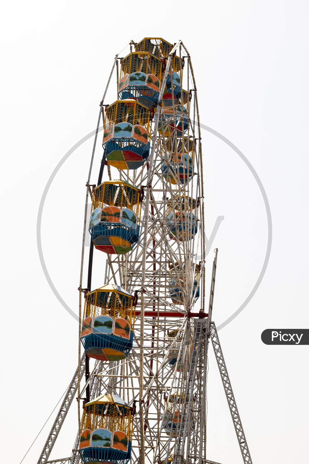 Ferris Wheel In Amusement Park Isolated On White Background