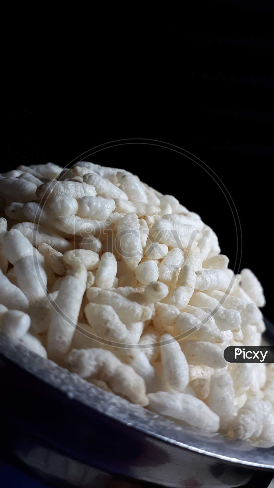 A Picture Of A Cup Of Puffed Rice.