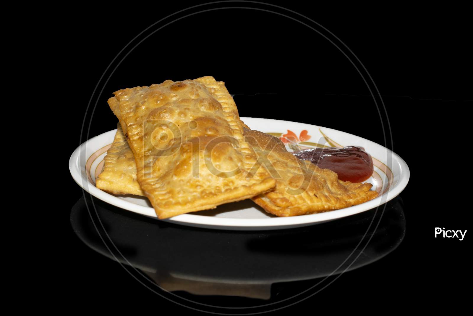 Pizza Puff, Puffed Pizza isolated with Black Background with shadow