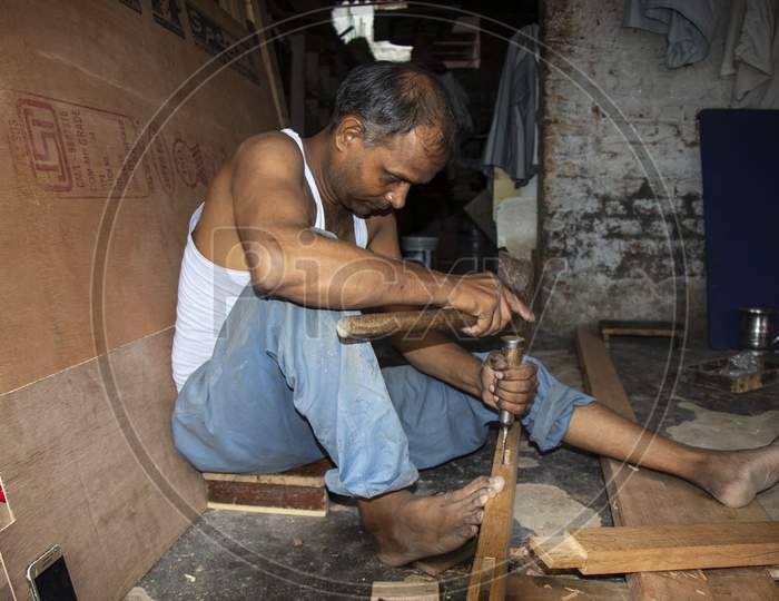 Indian man working in a workshop