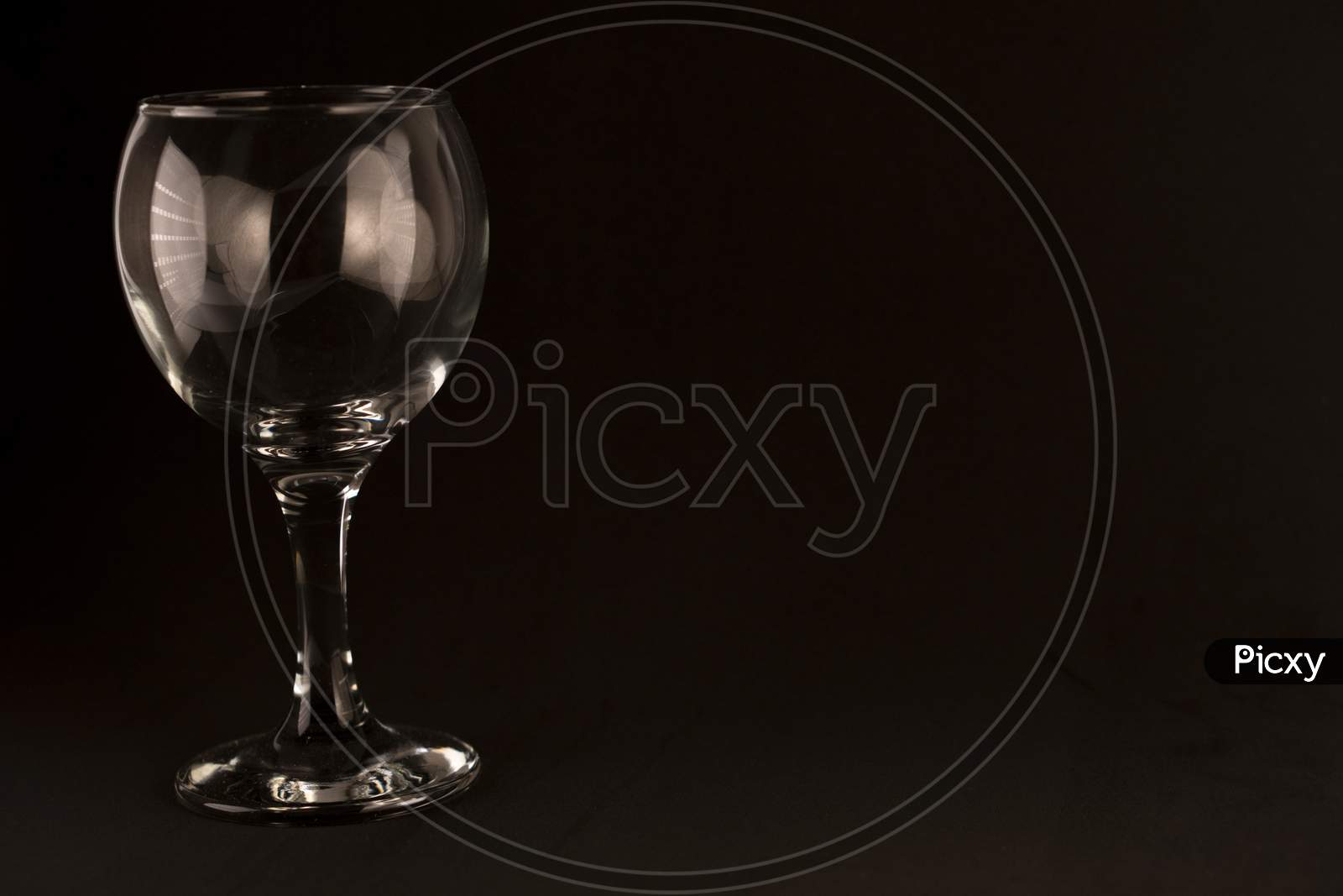 picture of empty wine glass on a black background