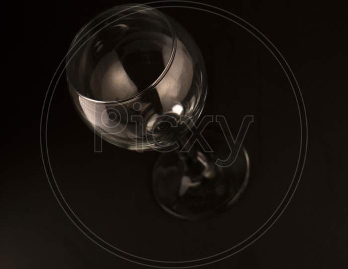 picture of empty wine glass on a black background
