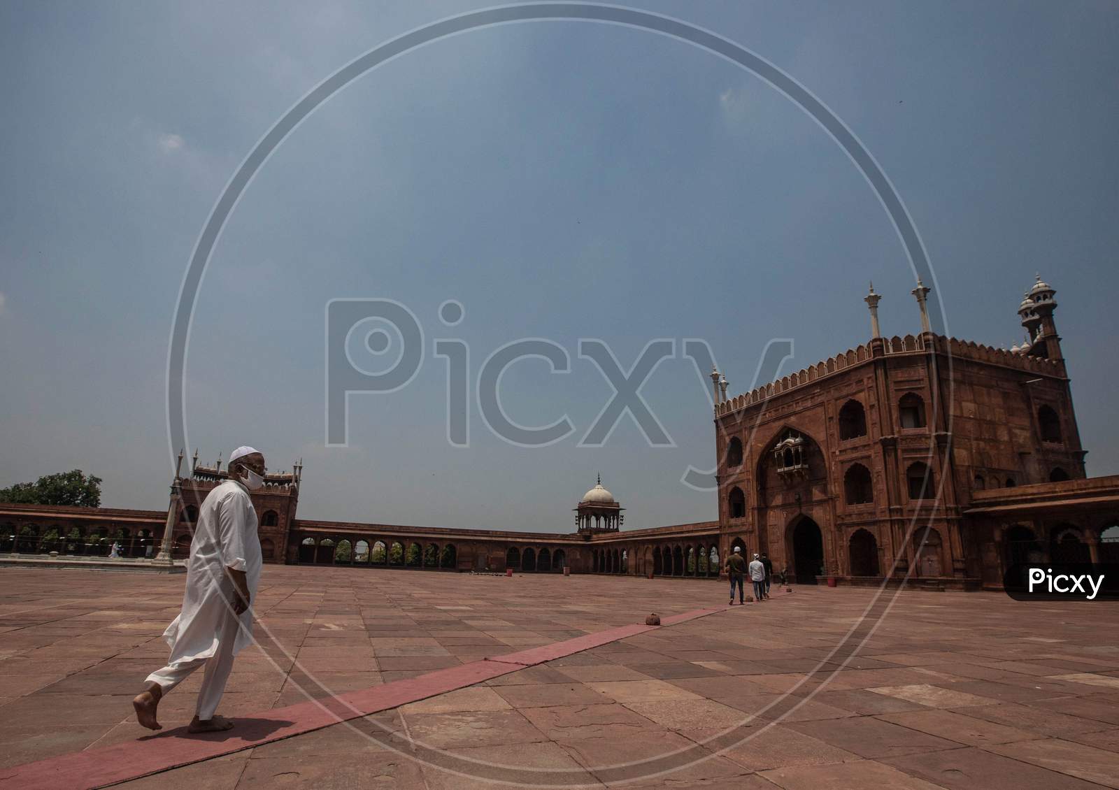 Muslims Walk Towards Jama Masjid After The Opening Of Most Of The Religious Places As India Eases Lockdown Restrictions That Were Imposed To Slow The Spread Of The Coronavirus Disease (Covid-19), In The Old Quarters Of Delhi, India, June 8, 2020.