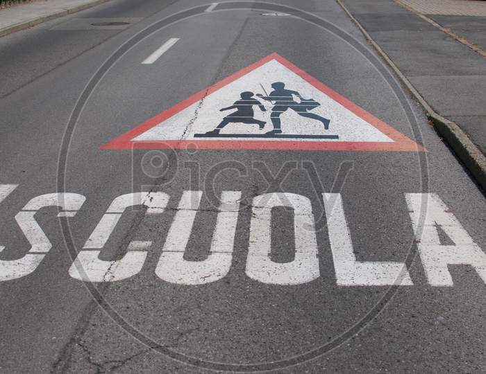 Attention Children Crossing For School Sign Drawn On The Street