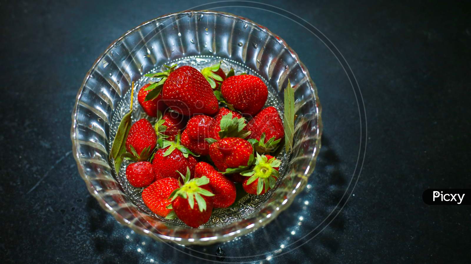Group Of Strawberry In Glass Bowl, Red Colour Fruit, Strawberry In Dark Background