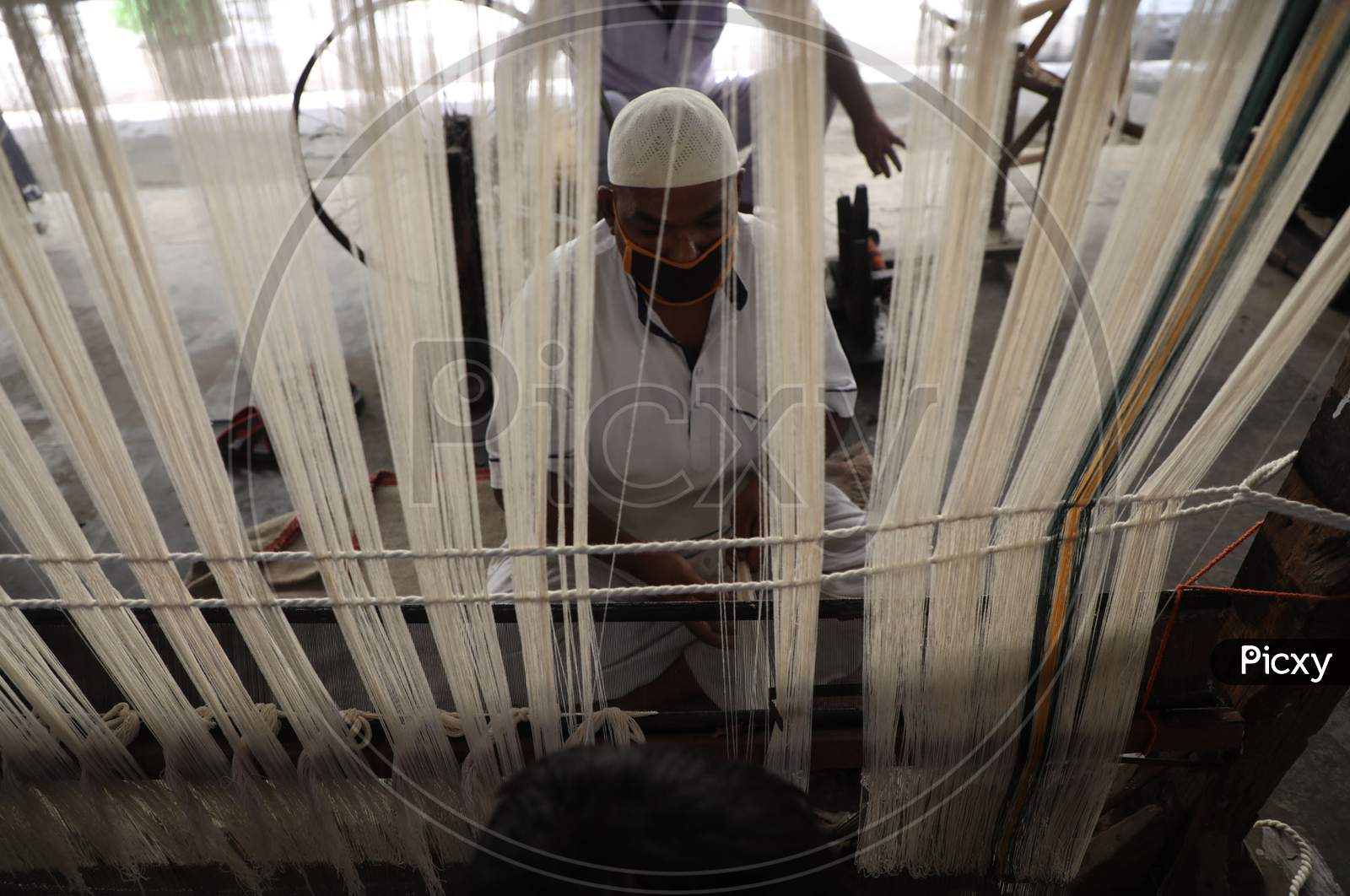 Jail inmates wear face mask while working at the district jail Amphalla in Jammu