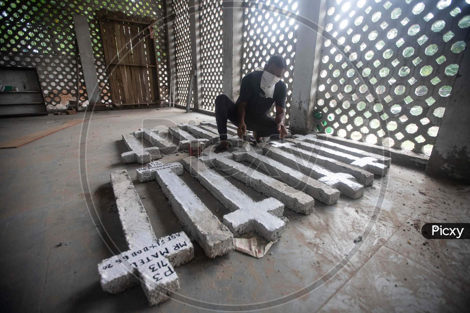 A Cemetery Worker Prepares Fresh Grave Markers For Covid-19 Victims  At Mangolpuri Cemetery Amid The Covid-19 Pandemic On July 1, 2020 In New Delhi, India.