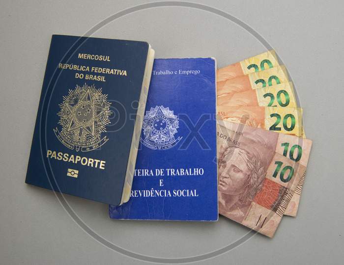 Brazilian Work Card (Carteira De Trabalho), Passport And Money. Translate: "Federative Republic Of Brazil, Ministry Of Labor. Work Record Booklet And Social Welfare."