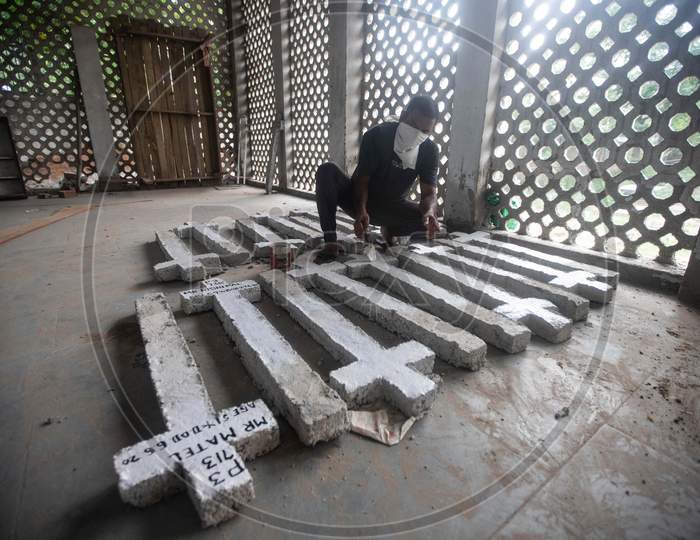 A Cemetery Worker Prepares Fresh Grave Markers For Covid-19 Victims  At Mangolpuri Cemetery Amid The Covid-19 Pandemic On July 1, 2020 In New Delhi, India.