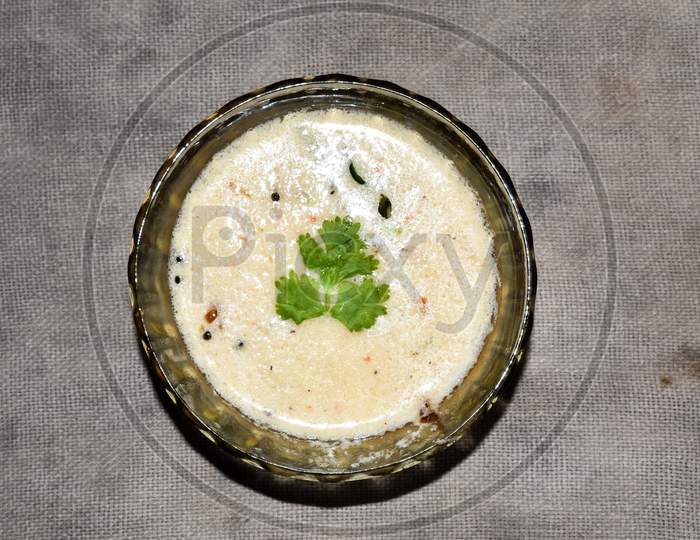 South Indian Cuisine - White Coconut Chutney Served In A Glass Bowl.