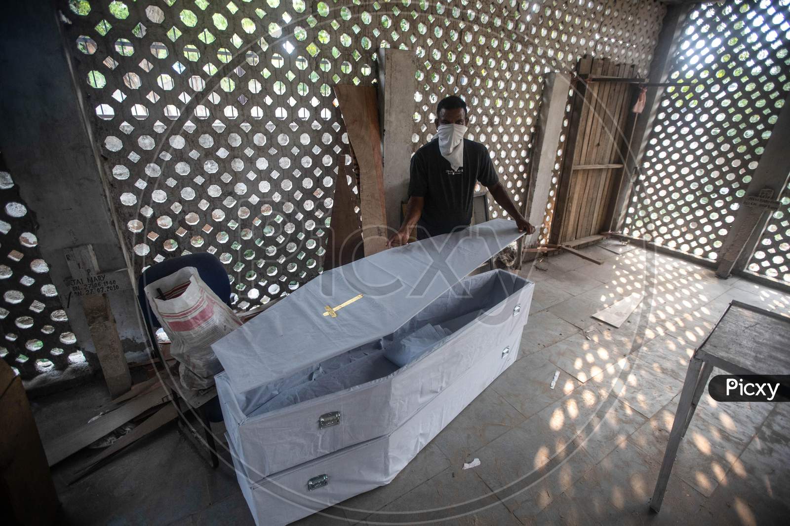 A Cemetery Worker Prepares Coffin Box At Mangolpuri Cemetery Amid The Covid-19 Pandemic On July 1, 2020 In New Delhi, India.