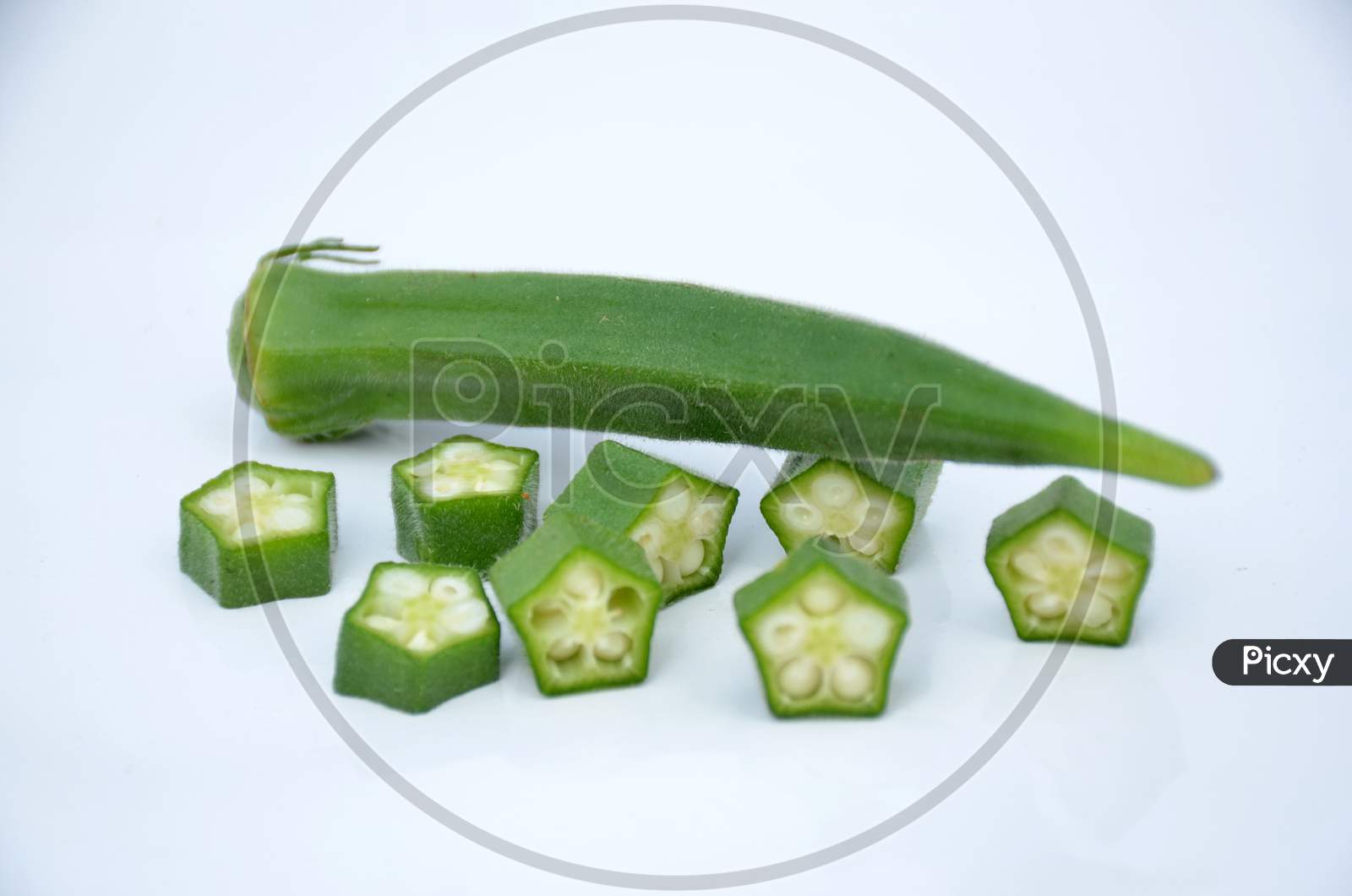 the ripe green ladyfinger with cutt roll isolated on white background.