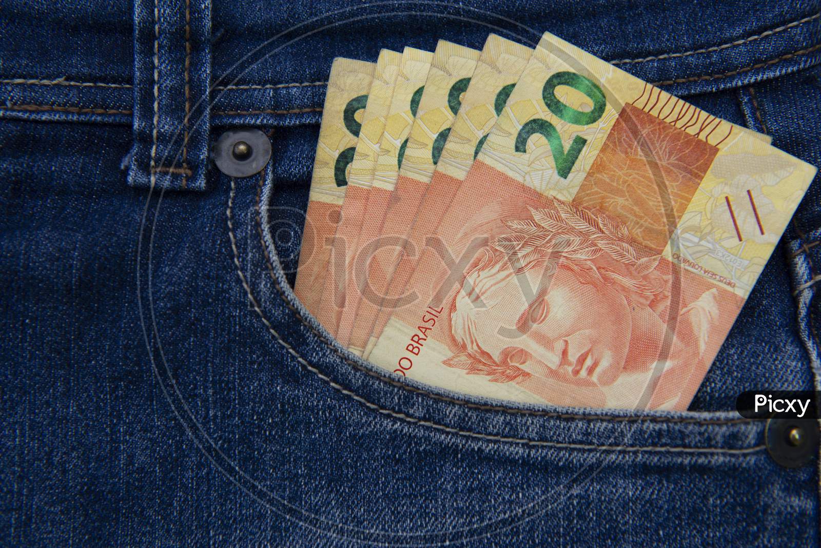Close Up Of Several 20 Reais Bills In The Pants Pocket. Money In Pocket Concept. Money-Rich Person Or Money To Spare.