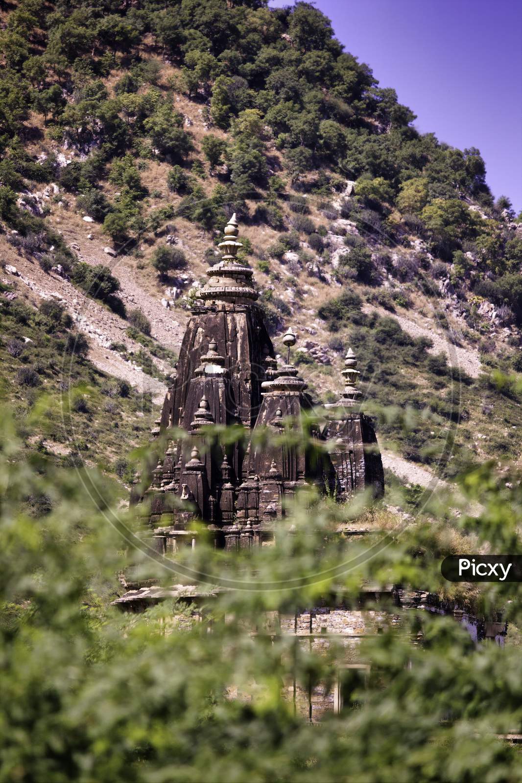 Rajasthan, India - October 06, 2012: A Landscape Containing Ancient Temple Ruined Surrounding Abandoned Cursed Fort In A Place Named Ajabgarh On A Way To Allegedly Haunted Place Bhangarh Fort