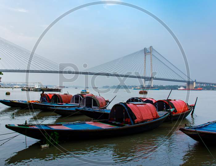 Second Hooghly Bridge, Vidyasagar Setu Landscape photo from princep ghat kolkata west Bengal with some small boat in Ganges river