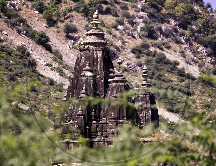 Rajasthan, India - October 06, 2012: A Landscape Containing Ancient Temple Ruined Surrounding Abandoned Cursed Fort In A Place Named Ajabgarh On A Way To Allegedly Haunted Place Bhangarh Fort