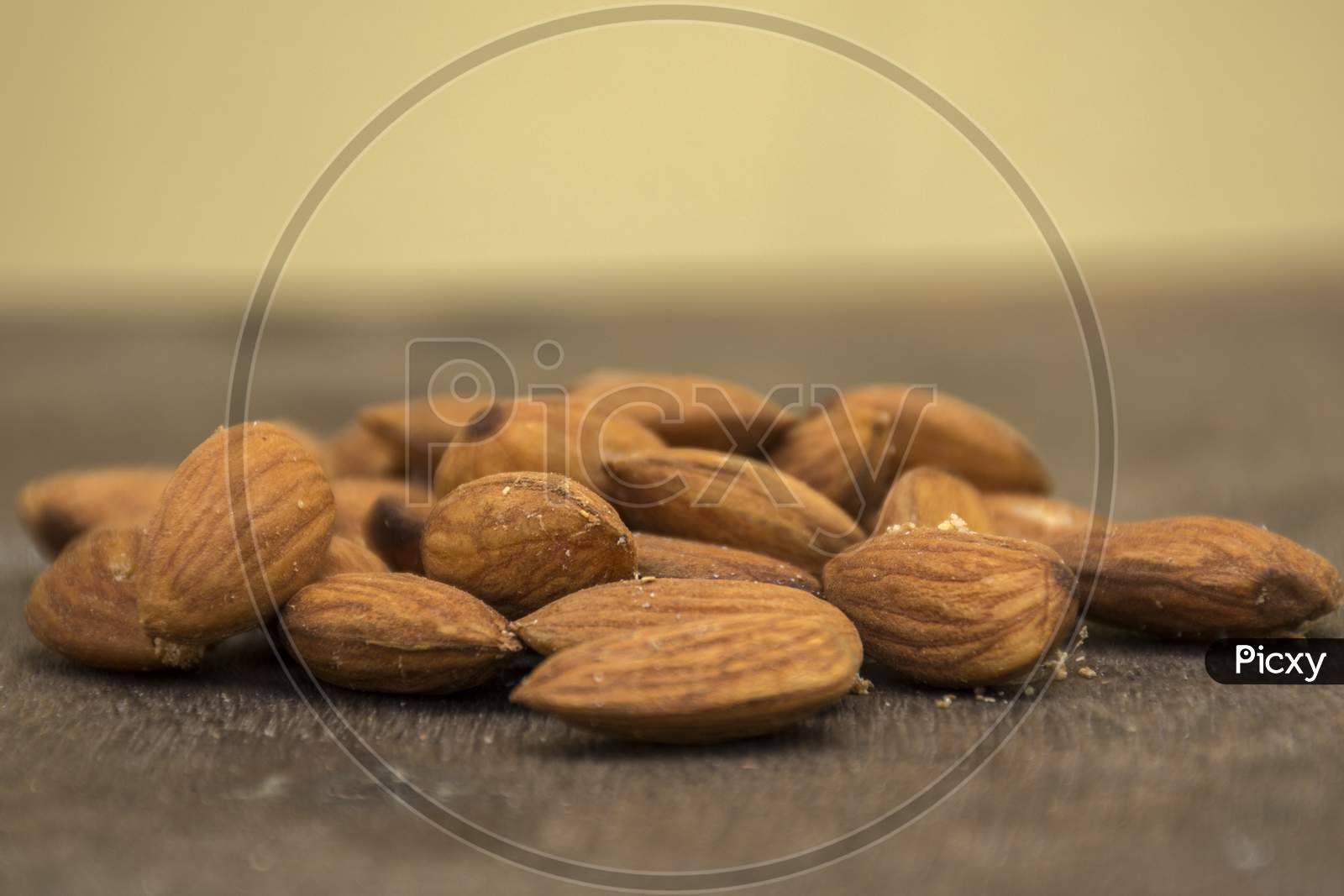 Organic Almonds On Wooden Surface