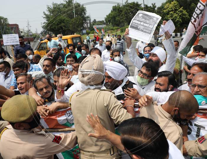 Congress Party workers who were moving towards the Divisional Commissioner Office are stopped by the police as they protest against the hike in the prices of petrol and diesel, in Jammu