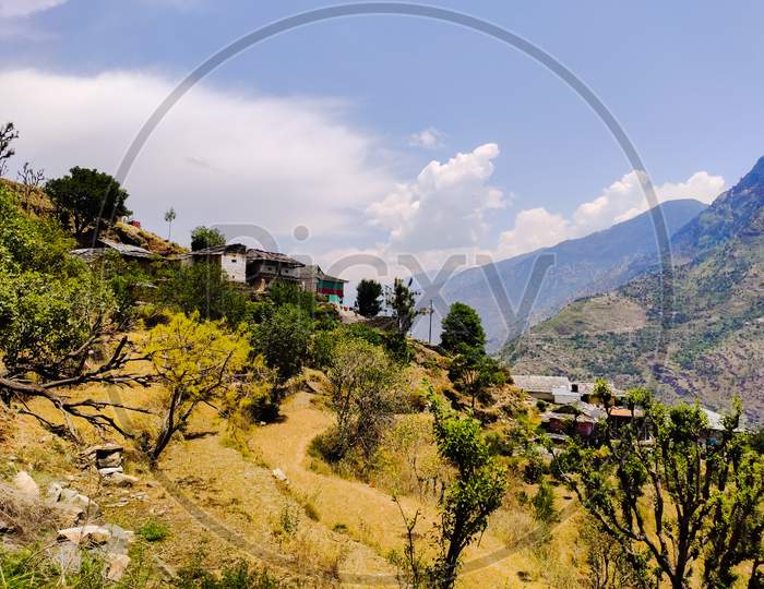 A small village on the edge of a Cliff, mountain in Himachal Pradesh India