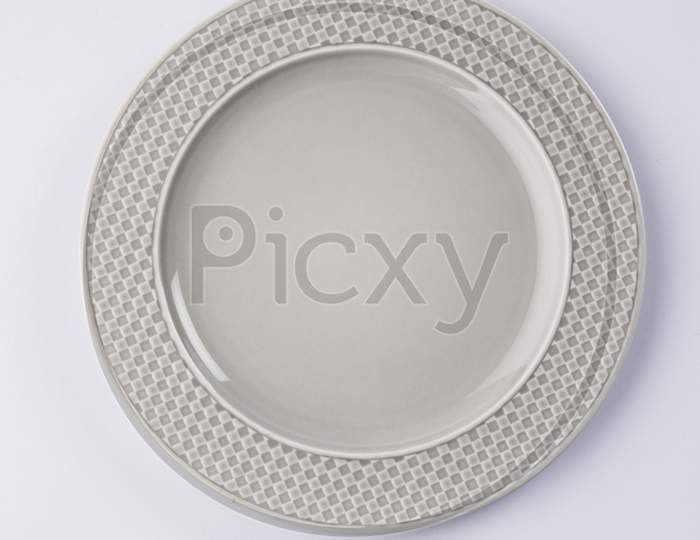 Empty grey ceramic round plate