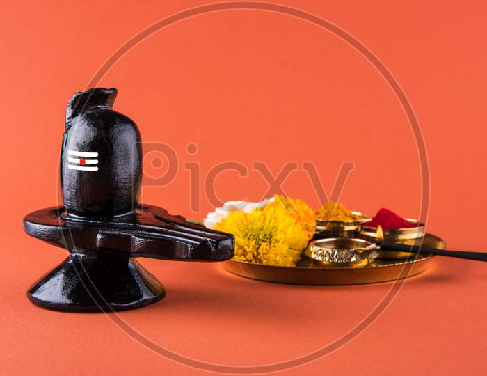 Maha Shivaratri concept with Shiva Linga and flowers with Haldi Kumkum