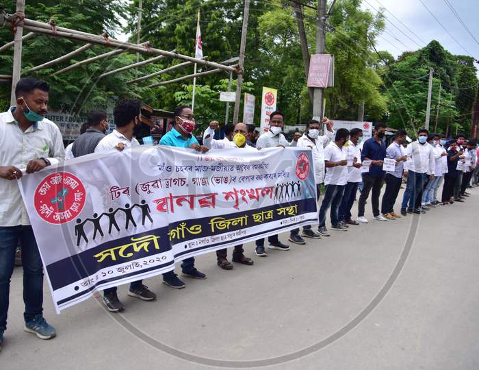Members of All Assam Students Union(AASU) form a human chain to protest against drugs abuse in Nagaon, Assam on July 10, 2020