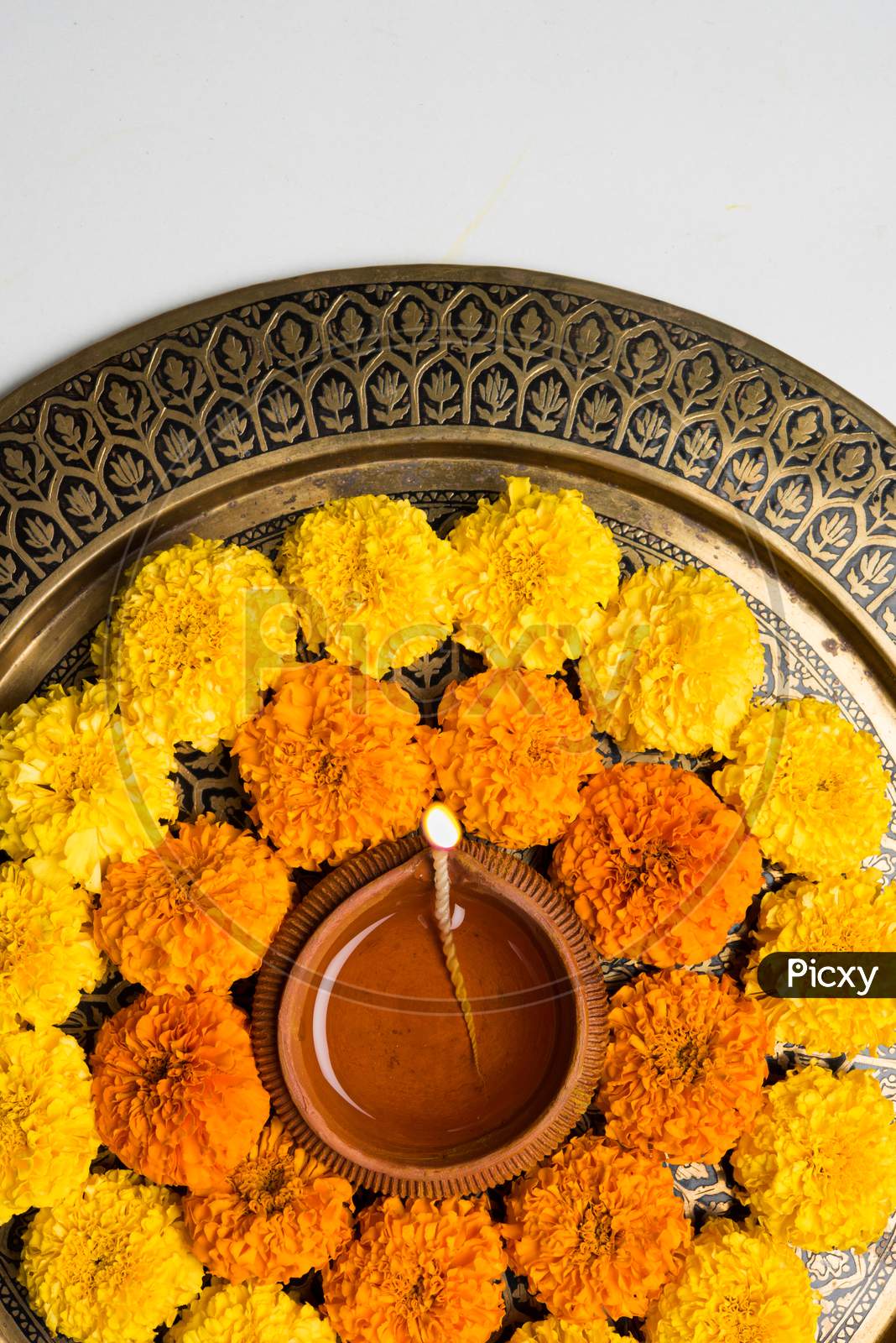flower rangoli with diya for diwali celebration