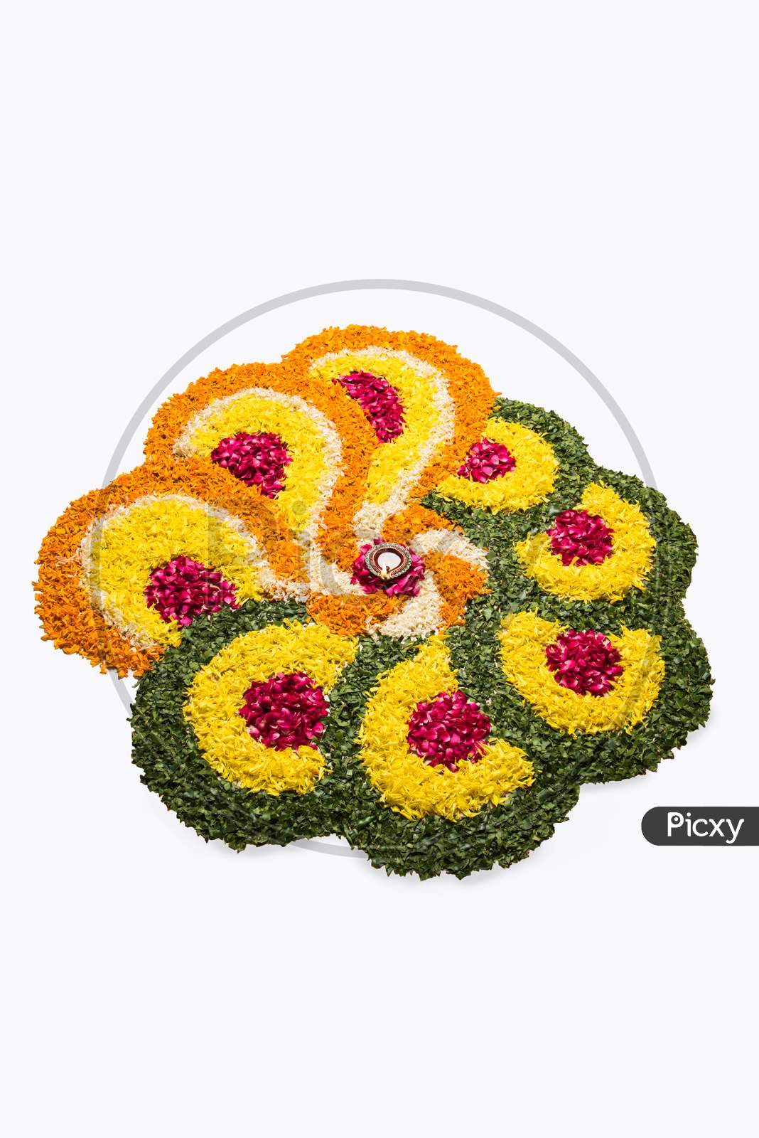 flower rangoli for Diwali or pongal with diya or clay oil lamp