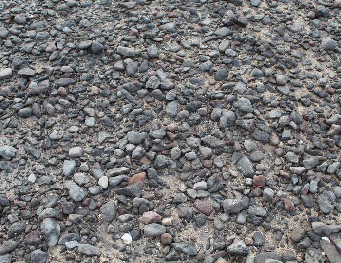 Small Stones In Concrete Ground Texture.