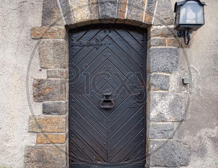 Old Wooden Door With Iron Elements In Medieval Defensive Czocha Castle.