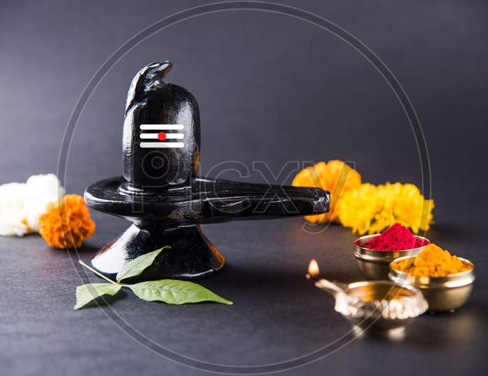 Maha Shivaratri concept with Shiva Linga and flowers with Haldi Kumkum