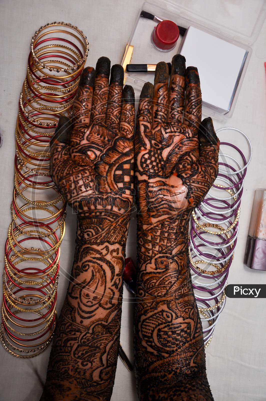 Woman Hand With Black Henna Tattoo On Jewelry.