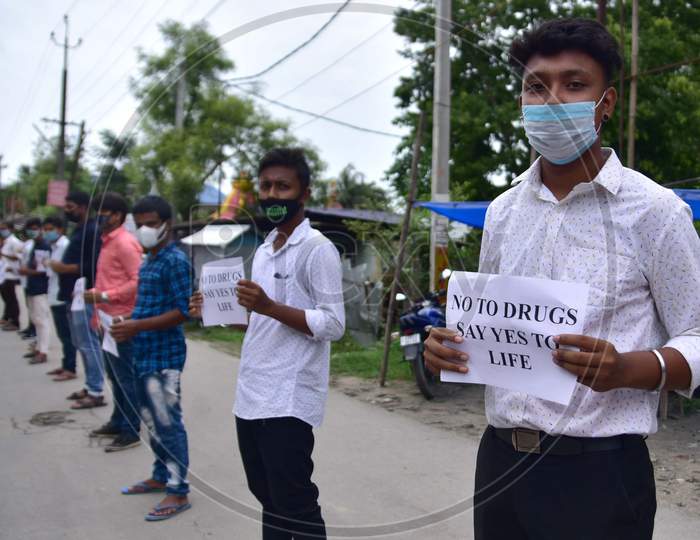 Members of All Assam Students Union(AASU) form a human chain to protest against drug abuse in Nagaon, Assam on July 10, 2020