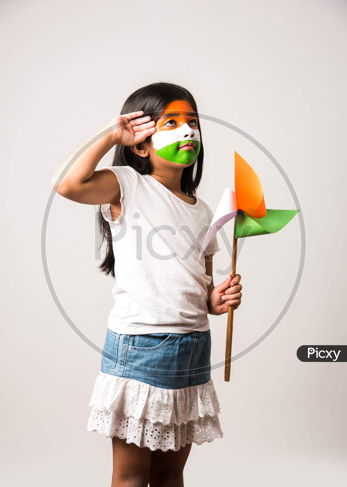 Cute Indian girl holding flag or tricolour