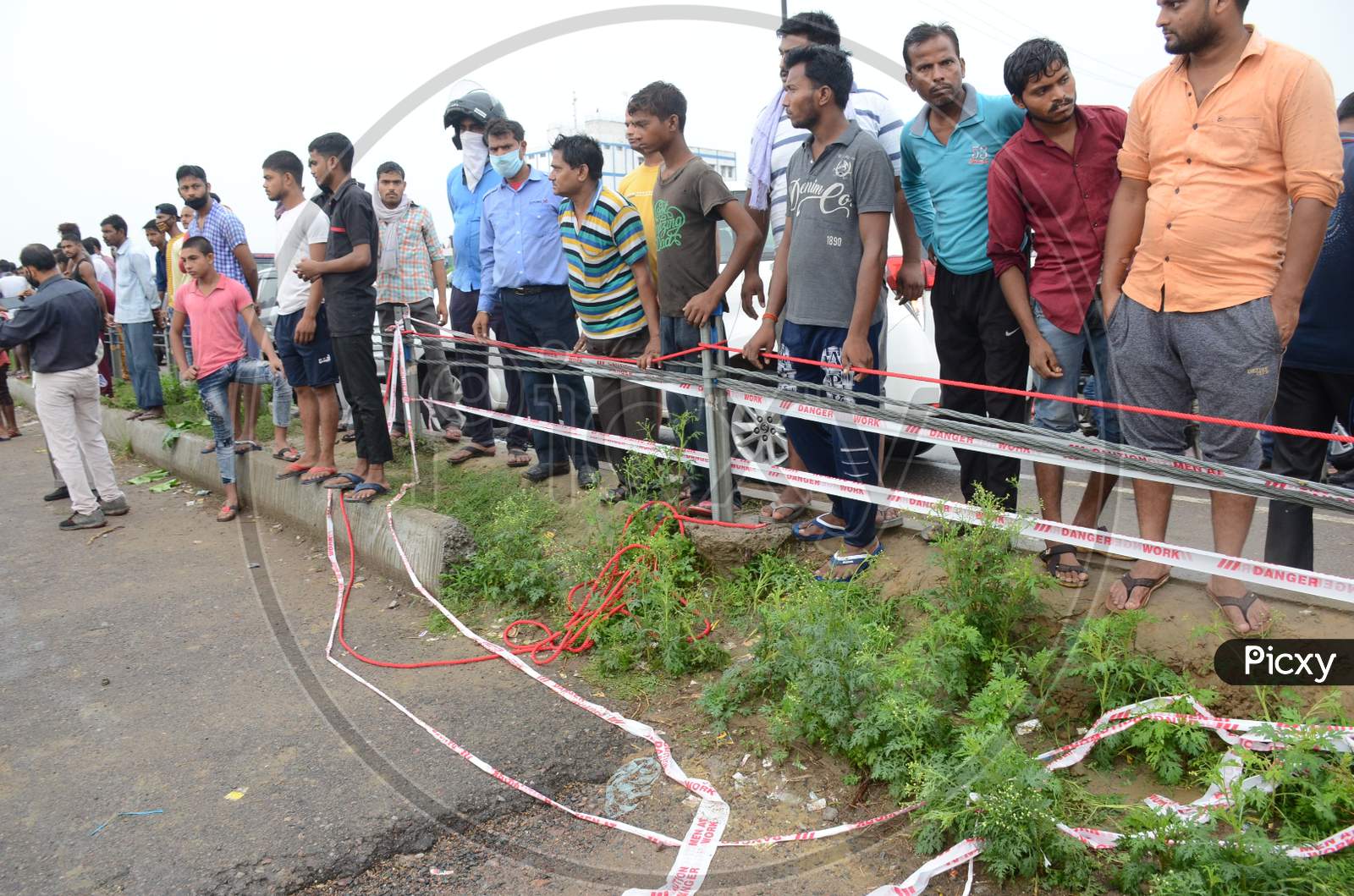 Bystanders at the site of the encounter where gangster Vikas Dubey who was killed when he tried to escape from police custody in Kanpur, Uttar Pradesh on July 10, 2020