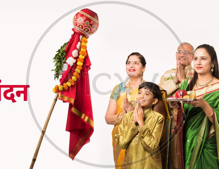 Indian family celebrating Gudi Padwa or Ugadi festival which is a hindu new year