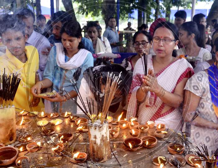 Devotees lighting  the earthen lamp to offer prayers to Lord Ganesha on the occasion of the 'Ganesh Chaturthi' festival