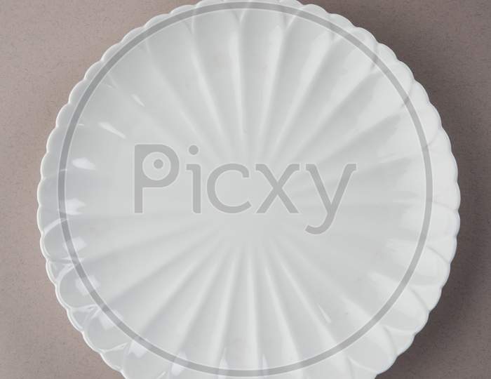 Empty white ceramic round plate