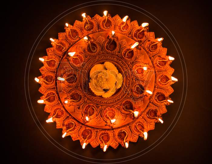 Beautiful illuminated terra-cotta Diwali diya Plate