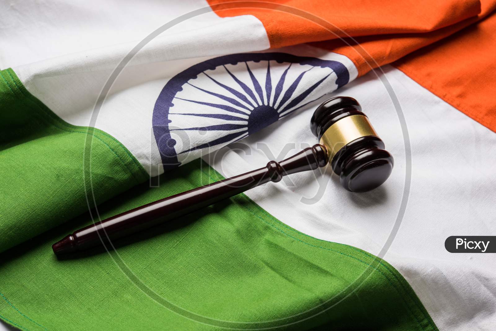 Indian Law concept showing wooden Gavel and Indian Flag