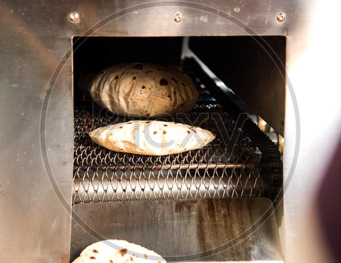Roti or chapati making machine, selective focus