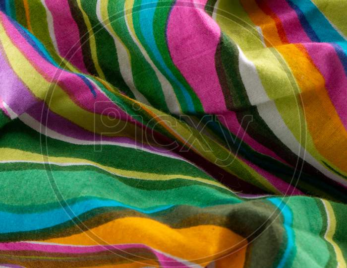 Bright multi coloured Shades Textured Fabric Background